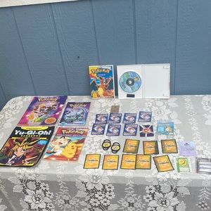 Pokémon cards, books and dvds , neopets cards and clips yu gi oh book